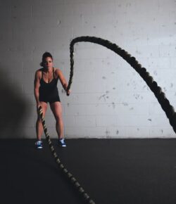 A client performing high-intensity battle rope exercises during a private personal training session in Marin, CA.
