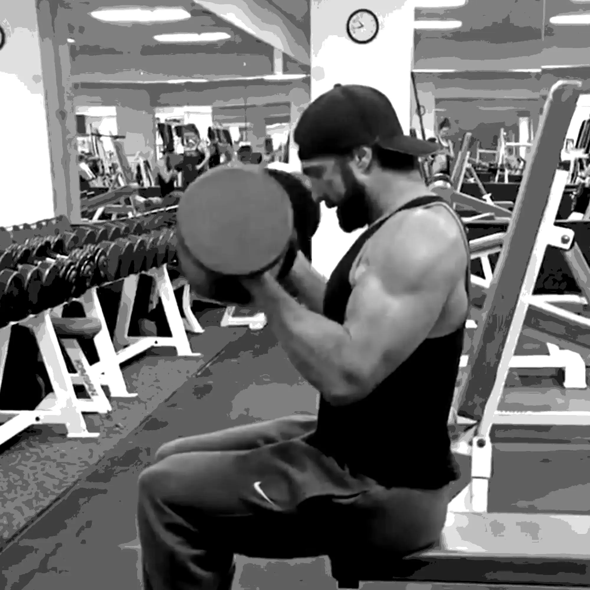 LaPlant Fitness Personal Training Studio Personal trainer Nick LaPlant performing a seated dumbbell bicep curl while traveling, maintaining his fitness routine outside his Marin gym.