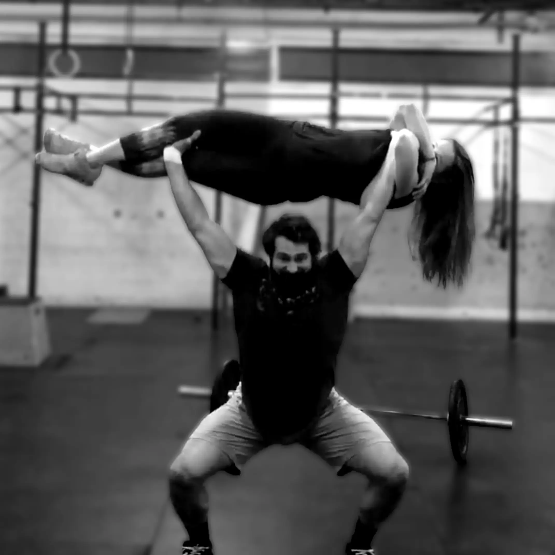 LaPlant Fitness Personal Training Studio Personal trainer Nick LaPlant performing a high-skill overhead lift with a client in a private gym setting in Marin, CA.